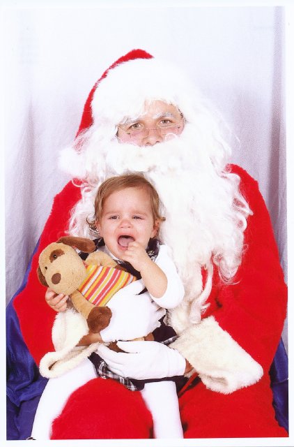 Santa 2009.jpg - Santa and his crew now know that Catherine has quite a set of lungs on her for a little peanut!